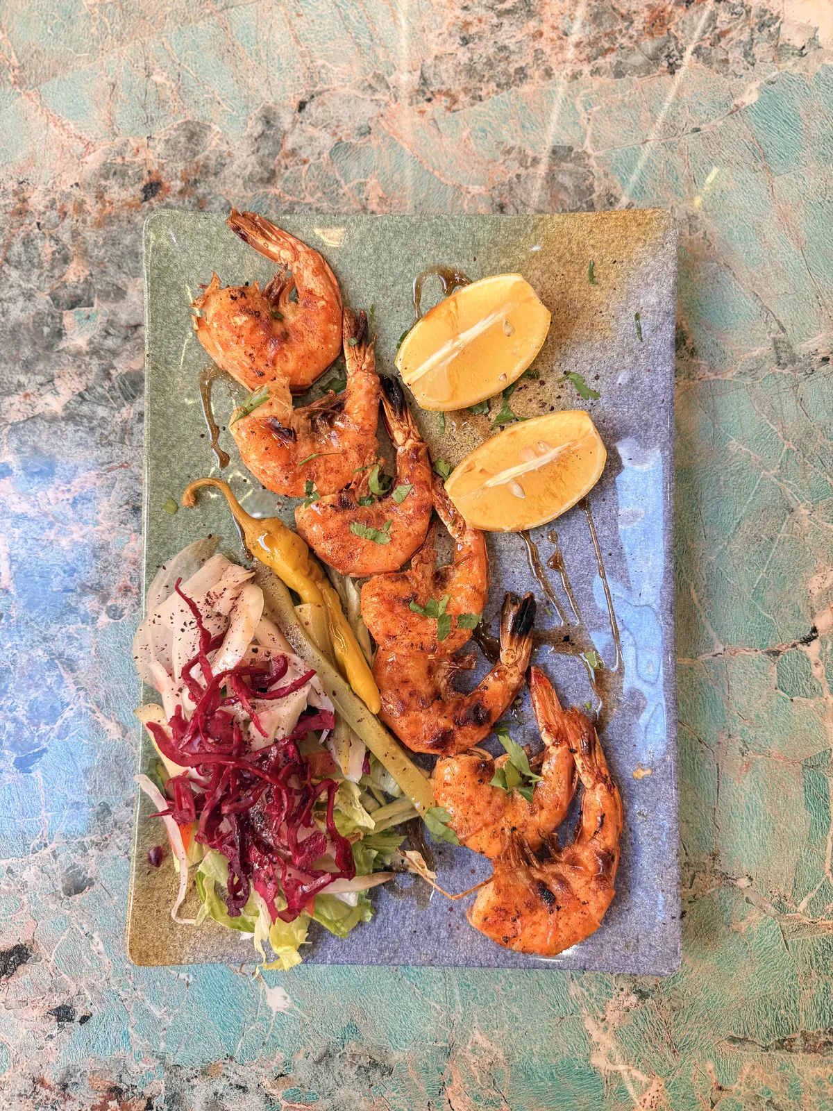 Grilled king prawns with lemon and fresh salad